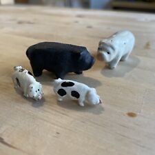 Set Of Four Tiny Cast Iron Pigs  picture