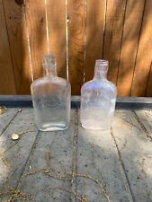 Two Texas Whiskey Flasks from Houston, one marked 