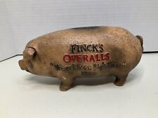 Finck's Overalls Advertising Cast Iron Pig Piggy Bank ”Wear Like A Pig’s Nose” picture