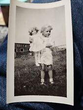 1930s Girl with Doll VINTAGE PHOTO Found snapshot Field Building  Creepy  picture