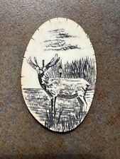 VINTAGE DECORATIVELY HAND CARVED MOOSE AND BACKGROUND WITH ANTLER BONE, BOLO TIE picture