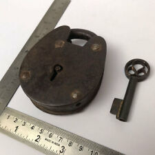 An old or antique iron padlock lock with key decorative oval shape. picture