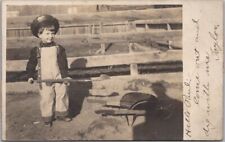 1908 Real Photo RPPC Postcard Little Boy in Garden w/ Shovel & Tiny Wheelbarrow picture