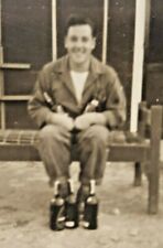 Vintage WWII Photo GI Airman Outside Australia Barracks with Alcohol Bottles picture