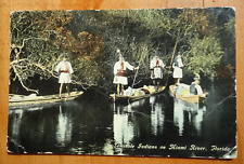 Seminole Indians on Miami River, FLORIDA postcard poles and boats picture