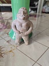 Figural Vessel Of Man Rubbing Belly picture