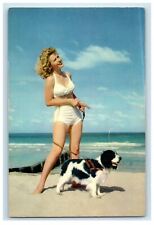 c1950's Sexy Girl And Paddle Dog Strolling On The Beach Vintage Postcard picture