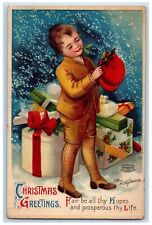 c1910's Christmas Greetings Boy With Gifts Ellen Clapsaddle Embossed Postcard picture