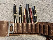 An antique bullet gun belt that can be used as a fountain pen holder #556f2b picture