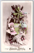 Vintage Tinted Postcard French Girl Bonne Annee with Christmas Dolls & Toys picture