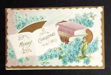 Merry Christmas Books Feather Light Blue Flowers Gold Embossed Postcard c1910s picture