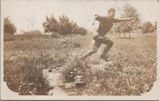 RPPC Postcard Man Running in a Field  picture