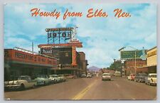 Elko Nevada, US Highway 40 Street View Old Cars Shops Signs, Vintage Postcard picture