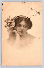 c1911 Young Lady Holding Flowers Next To Her, Nice Msg ANTIQUE Postcard picture