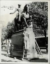 1967 Press Photo Workers clean vandalized Paul Revere statue in Boston picture