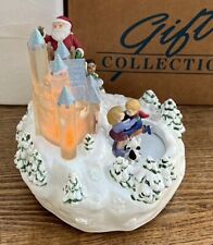 Musical Lighted Santa Christmas Decoration Avon Gifts Collection Skaters Puppy picture