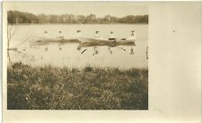 vintage RPPC photo young woman rowing boats on lake sepia Victorian era hats picture