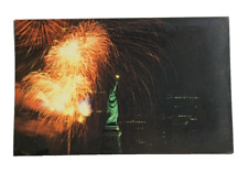 The Statue of Liberty on Liberty Island New York Harbor  with Fireworks Postcard picture