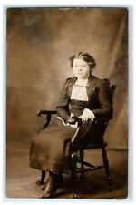 1912 Victorian Woman Sitting Wicker Chair Studio Portrait RPPC Photo Postcard picture