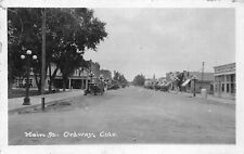 J38/ Ordway Colorado RPPC Postcard c1920s Main Street Automobile Stores 54 picture