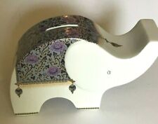 Ceramic Sleek White Elephant Coin Bank Adorned Rug with Rose Colored Flowers picture