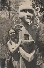 Photo Native Girl Next to Totem Pole Native Statue? picture