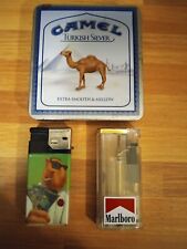 3 Vintage Marlboro Camel Cash Lotto Tobacco Cigarette Advertising Lighters & Tin picture