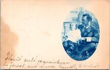 RPPC Cyanotype Oval Man on ground with child New Year Greeting Soldier Idaho ID picture