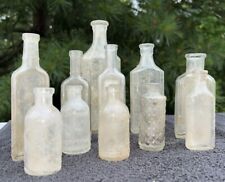 Lot of 11 Vintage Old Bottles Clear Plain Embossed Medicine Bottles picture