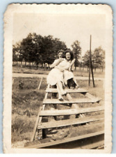 Vintage Photo 1930s, 2 Girls Snuggled atop lumber, Posed, 3.5 x 2.5 picture