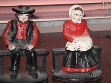 Vintage heavy cast iron Amish man and woman bookends 4 1/2