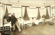 Fire Fighters Dressing Ready to Slide Down Pole Real Photo Postcard c1910 picture