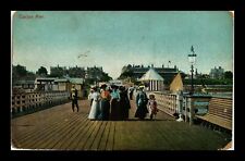 VINTAGE POSTCARD CLACTON PIER PEOPLE IN PERIOD DRESS  ENGLAND UNITED KINGDOM picture