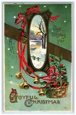 1911 Christmas Bells Holly Berries In Basket Embossed Freeport IL Postcard picture