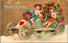 Postcard~Valentine~Two Cupids in Heart Decorated Car~Embossed~Posted 1912 picture