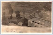 Postcard RPPC Coffins Caskets Stacked Pskov Caves Monastery Pechory Russia AP10 picture