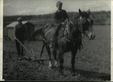 1935 Press Photo Lawrence Larson, Henry Jensen & a horse work a garden in Alaska picture