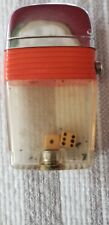 VINTAGE SCRIPTO VU LIGHTER WITH WHITE DICE INSIDE THICK ORANGE BAND WORKS GREAT picture
