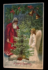 Red Robe~Santa Claus Cuts Xmas Tree ~with Angel-Antique~Christmas Postcard~k141 picture