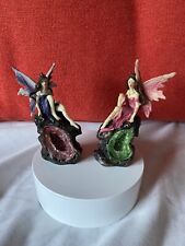 Lot of  2: Resin Pink Winged &Purple Winged Fairy Figures Each Sit on Geode. VGC picture