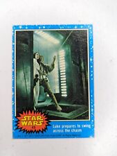 1977 Topps Star Wars Blue Series 1 #43 Luke prepares to swing across the charm picture