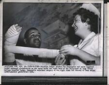 1956 Press Photo Nurse taping up arm of Brooklyn Dodgers catcher Roy Campanella picture
