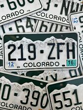 COLORADO ROCKY MOUNTAINS WHITE LICENSE PLATE RANDOM LETTERS/NUMBERS picture