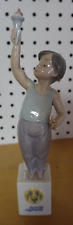 LLADRO #7513 SPECIAL OLYMPICS BOY HOLDING TORCH picture