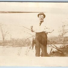 c1910s Cool Man Fish Catch RPPC Fisherman Smokes Pipe Outdoors Nature Photo A174 picture
