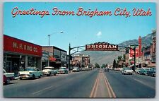 Postcard Greetings Brigham City Utah Street View Old Cars Mountains Signs VNG picture