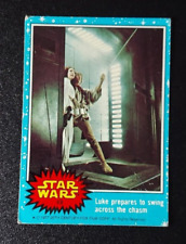 1977 Star Wars trading card #43 Luke Leia prepares to swing series 1 blue VG picture