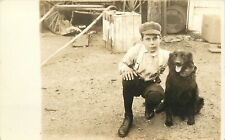 c1907 RPPC Postcard; Boy w/ Arm Around Black Lab Type Dog has Intense Gaze picture