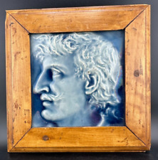 PAIR OF BLUE CERAMIC FRAMED TILES OF A MAN WITH MUSTACHE AND WOMAN picture