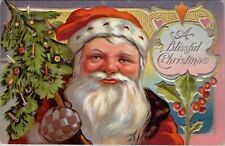 Blissful Christmas Santa Claus Bright Face Holding Tree Embossed Postcard X19 picture